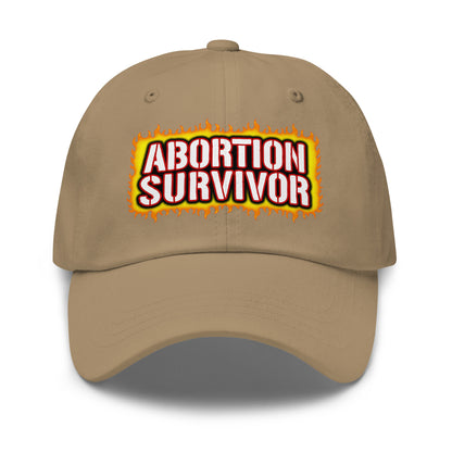 Offensive embroidered dad hat with the phrase Abortion Survivor.
