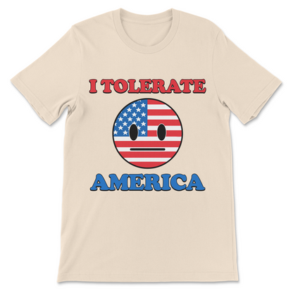 Funny American political satire shirt reading I Tolerate America with unimpressed USA flag face and sarcastic patriotic humor
