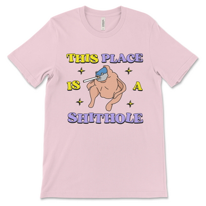 This surreal This Place Is a Shithole shirt political satire anti-USA graphic tee, is an offensive dark humor t-shirt, anti-establishment joke and inappropriate novelty shirt.