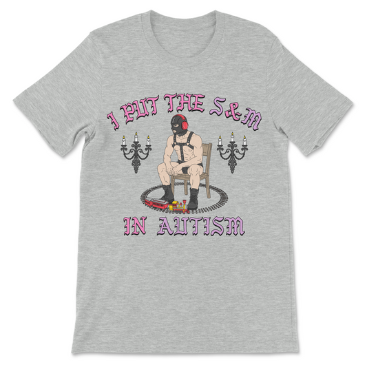 Funny autism shirt reading I Put The S and M In Autism with trains, noise cancelling headphones, and BDSM humor.
