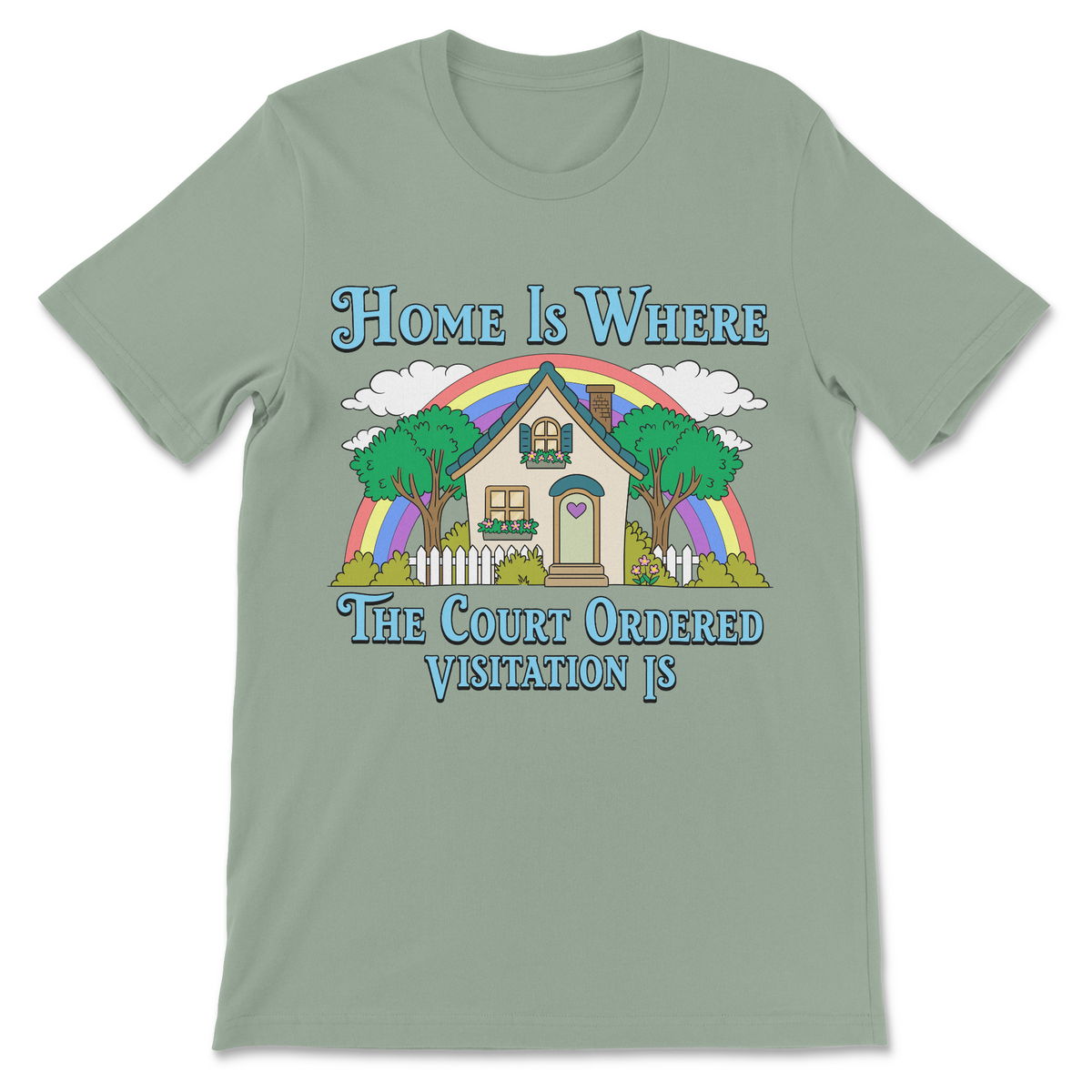 A sage green short-sleeve t-shirt with a colorful graphic of a house under a rainbow, accompanied by the text 'Home Is Where The Court Ordered Visitation Is'.