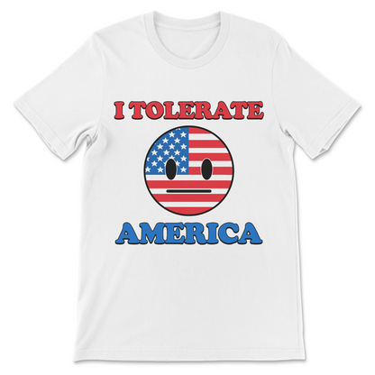 A white short-sleeve crewneck t-shirt featuring a graphic print with the text 'I TOLERATE' in red and 'AMERICA' in blue, surrounding a circular emoji face filled with the American flag pattern.