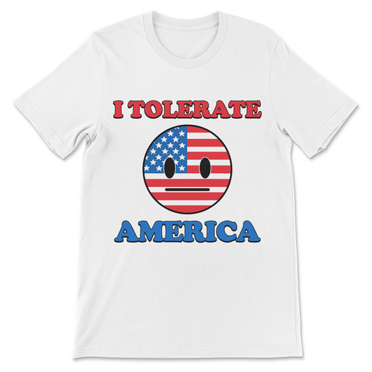 A white short-sleeve crewneck t-shirt featuring a graphic print with the text 'I TOLERATE' in red and 'AMERICA' in blue, surrounding a circular emoji face filled with the American flag pattern.