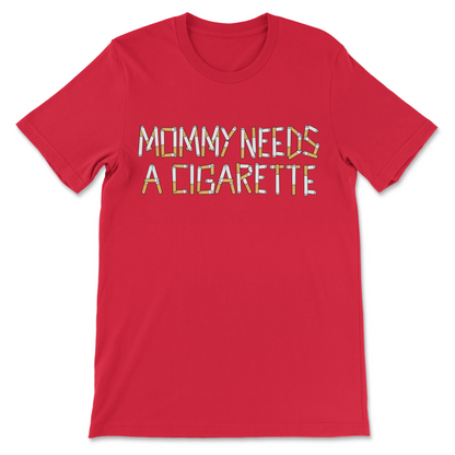 A red short-sleeve crewneck t-shirt featuring the text 'MOMMY NEEDS A CIGARETTE' printed across the chest in a stylized, multi-colored patterned font.