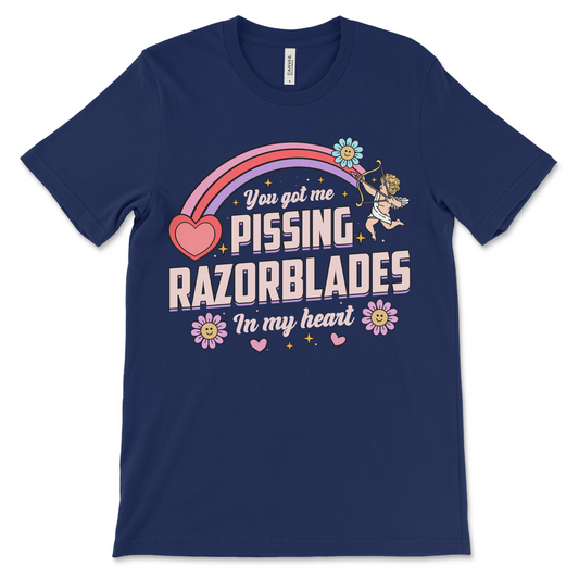 navy t shirt with the phrase “Pissing Razorblades,” obnoxious and really offensive design, inappropriate dark humor shirt, weird funny couples gift and raunchy dirty adult humor shirt.